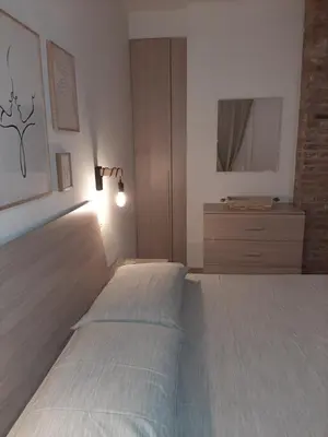 Letto o letti in una camera di Sotto il Portico Home