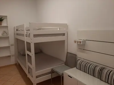 Letto o letti in una camera di Sotto il Portico Home