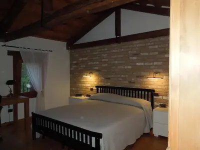 Letto o letti in una camera di Ca' Pinetta