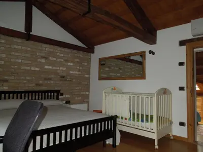 Letto o letti in una camera di Ca' Pinetta