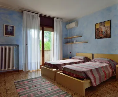 Letto o letti in una camera di B&B Villa Lattes