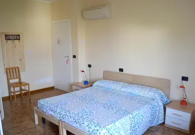 Letto o letti in una camera di B&B Villa Lattes