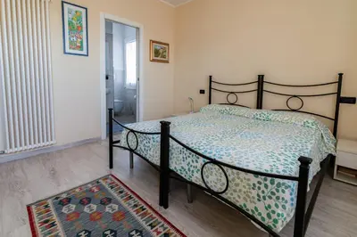 Letto o letti in una camera di B&B Villa Lattes