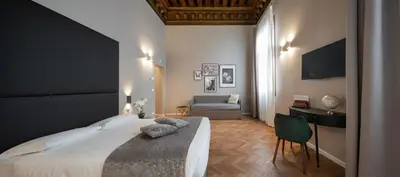 Letto o letti in una camera di Hotel Palazzo Martinelli Dolfin