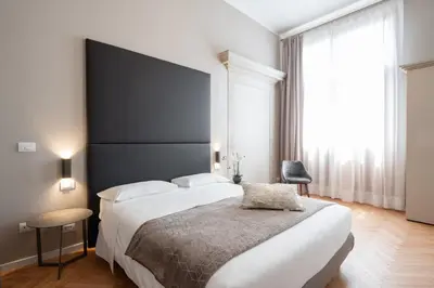 Letto o letti in una camera di Hotel Palazzo Martinelli Dolfin