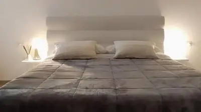 Letto o letti in una camera di Design House alla Biennale