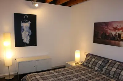 Letto o letti in una camera di Accogliente appartamento moderno, vicino a Venezia