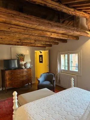 Letto o letti in una camera di Casa Augusta