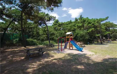 Area giochi per bambini di Lovely Apartment In Rosolina Mare