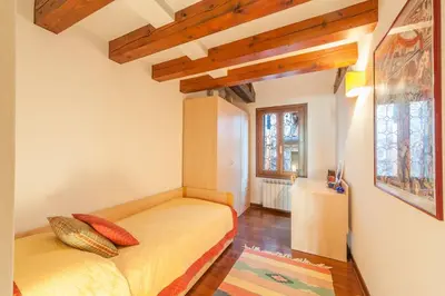 Letto o letti in una camera di Ca' delle Pizzocchere, a perfect spot in San Marco