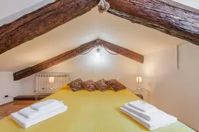 Letto o letti in una camera di Ca' delle Pizzocchere, a perfect spot in San Marco