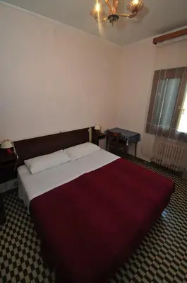 Letto o letti in una camera di Locanda Sant'Anna Hotel