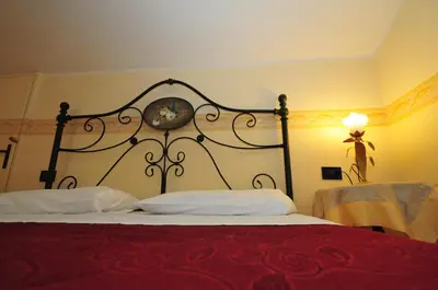 Letto o letti in una camera di Locanda Sant'Anna Hotel