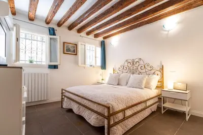 Letto o letti in una camera di San Giacomo Pied-A-Terre House by Wonderful Italy