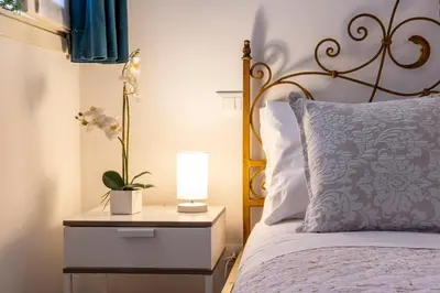 Letto o letti in una camera di San Giacomo Pied-A-Terre House by Wonderful Italy