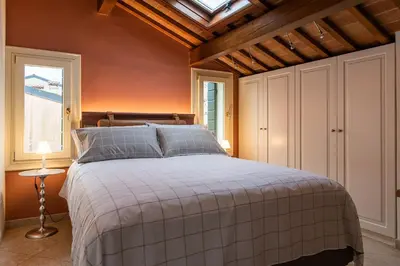 Letto o letti in una camera di Casa Giotto