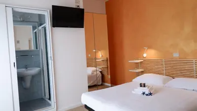 Letto o letti in una camera di Hotel Venezuela