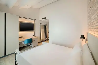 Letto o letti in una camera di NH Collection Murano Villa