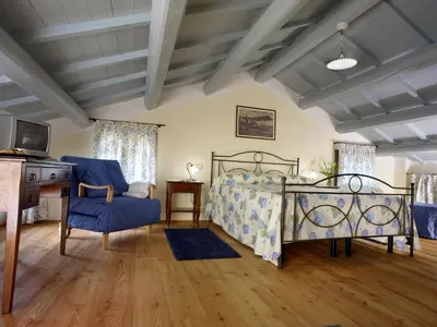 Letto o letti in una camera di Tenuta Le Risare