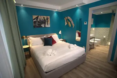 Letto o letti in una camera di Dimora del Teatro