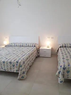 Letto o letti in una camera di Cala Blu Residence con piscina-Centralissimo Lido di Jesolo