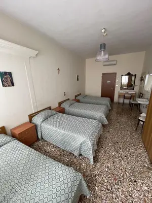 Letto o letti in una camera di Casa Caburlotto