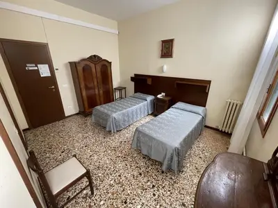Letto o letti in una camera di Casa Caburlotto