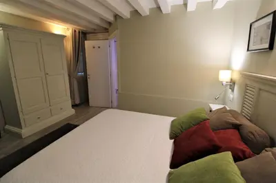 Letto o letti in una camera di San Marco Fenice 3bdr 2bth apartment