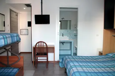 Letto o letti in una camera di Hotel Ondina