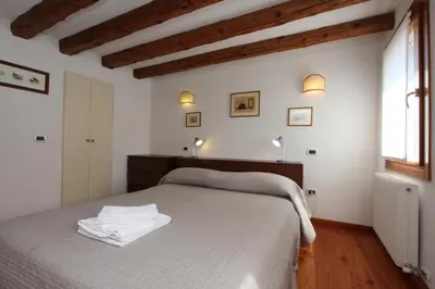 Letto o letti in una camera di Residence dei Mori