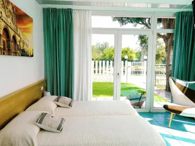 Letto o letti in una camera di Villa Marina