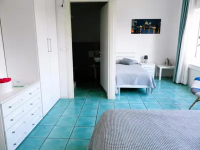 Letto o letti in una camera di Villa Marina