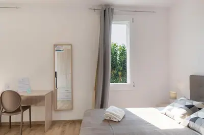 Letto o letti in una camera di San Vincenzo Rooms Vigonza