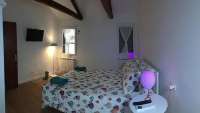 Letto o letti in una camera di Casa Romana