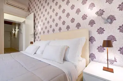 Letto o letti in una camera di Residence Le Beccarie - Rialto by Wonderful Italy