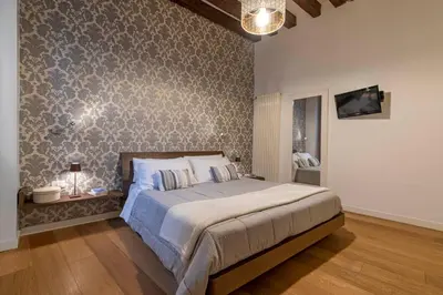 Letto o letti in una camera di Residence Le Beccarie - Rialto by Wonderful Italy