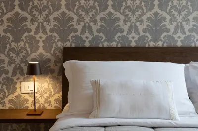Letto o letti in una camera di Residence Le Beccarie - Rialto by Wonderful Italy