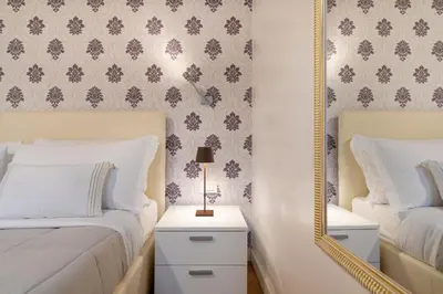 Letto o letti in una camera di Residence Le Beccarie - Rialto by Wonderful Italy