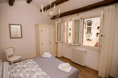 Letto o letti in una camera di Grimaldi Apartments Ca Del Moro