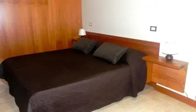 Letto o letti in una camera di SAN STAE CASA AURORA