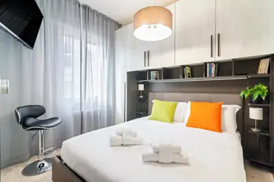Letto o letti in una camera di GuestHost - Scrovegni Urban Apartment