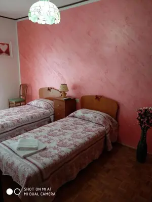 Letto o letti in una camera di C'a Stazione Venezia Mestre