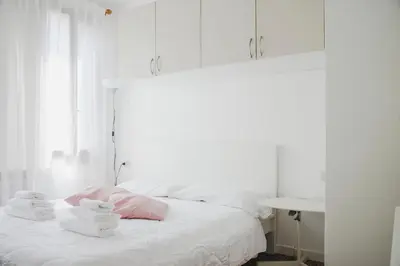 Letto o letti in una camera di Ca Giardini Apartments in Biennale by Bricola Apartments