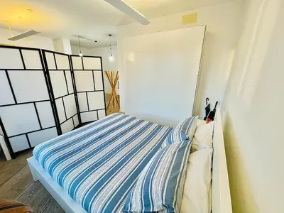Letto o letti in una camera di LOFT IN PIAZZA VITTORIA