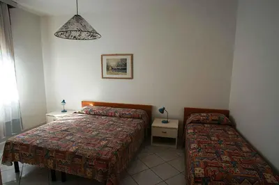 Letto o letti in una camera di Apartments in Lido di Jesolo 25357