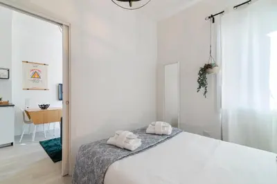 Letto o letti in una camera di GuestHost - Garden Mini Flat Specola