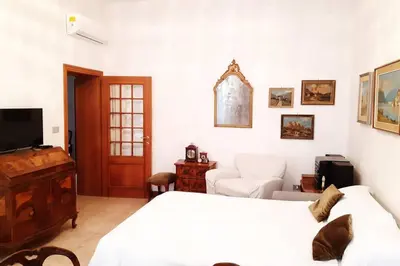 Letto o letti in una camera di Casa Pusterla