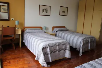 Letto o letti in una camera di Villa Flangini