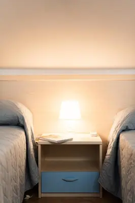 Letto o letti in una camera di Quadrilocale e Mansarde Bafile241 - Adria Holiday Jesolo - FAMILY APARTMENTS
