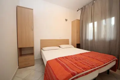 Letto o letti in una camera di Villa Debby appartamento 01
